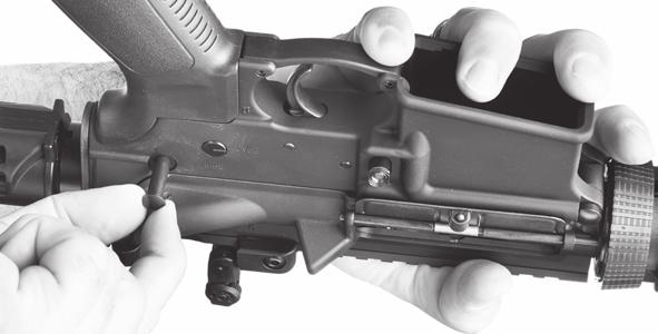 of the lower receiver. Make sure the bolt carrier is all the way forward in the upper receiver.
