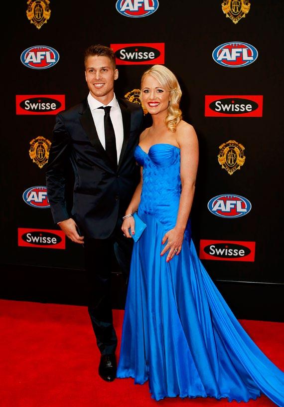 North Melbourne captain Andrew Swallow and his wife Elise arrive on the
