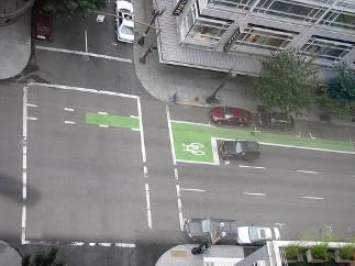 A 5-foot wide bike lane should be implemented on a curbside lane with a gutter.