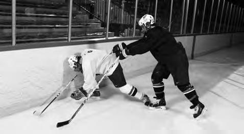 Always approach the puck at an angle to the boards, never straight on.