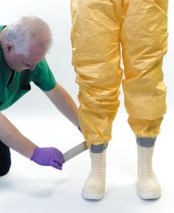 Critical aspects of the safe use of personal protective equipment TECHNICAL DOCUMENT [+/ ] Boots taped directly to the coveralls NO! Boots can also be taped directly to the coverall legs.