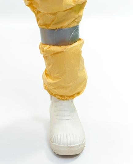 [+/ ] Coveralls taped to the boot cover: additional shoe covers over the clogs or boots In some settings it might be considered an advantage if boots or clogs are covered by boot covers.