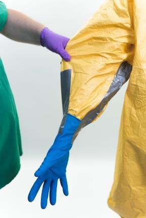 Tape the glove to the sleeve using a minimum of two strips of tape alongside the forearm. This option also ensures the easy removal of the PPE.