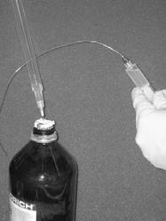 Syringe is kept needle-up to prevent spilling Push the plunger down to eject the inert gas and excess reagent back into the reagent vessel, stopping once the volume you need for your experiment is