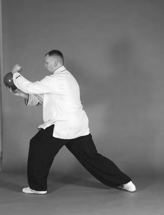 The ball will continue on its path forward while your body rocks forward into the deng san bu stance (Figures 5-188, 5-189, and 5-190).