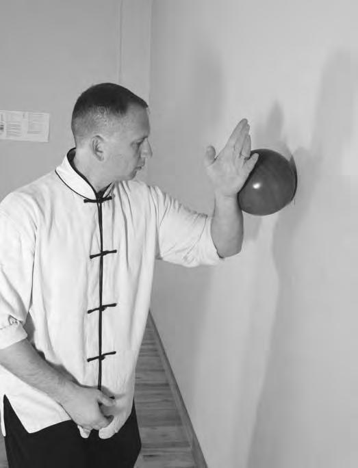The final stage of this exercise is to practice the wrap-coiling motion against the wall. Place the ball against the wall with your palm facing the ball.