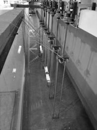 orthogonal components of the suspended particle velocities, Fig. 3. Together with the ADV probe, a resistive gauge was placed for simultaneous measurements of the free surface elevation, Fig. 3. In Phase II, the ADV probe was located in the middle of the water column.