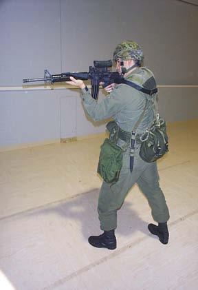 Marksmanship Theory and Coaching Figures 3-48a and b: Sling Support Standing and Prone Position b. Patrol Sling.