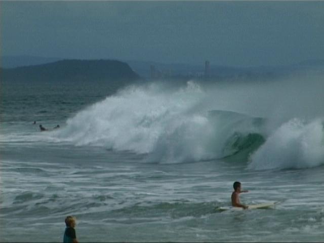 (B) Wave breaking near the shoreline on the Gold Coast, Rainbow Beach after two days of big