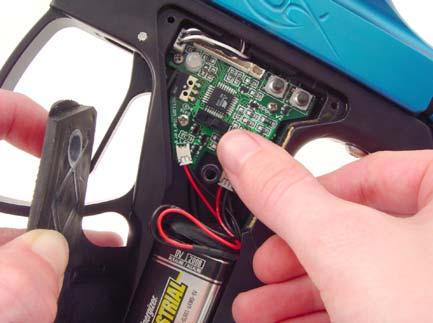Replace the plastic cover and rubber grip. Do not over tighten the screws. 7.