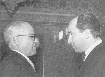 Successive Presidents of the TOC Mr. Habib Bourguiba, President of the Tunisian Republic, talking to Mr. Mohamed Mzali (right). of the senior member, Dr.