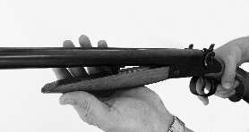 Use the thumb of your firing hand to move the top lever to its most right position.