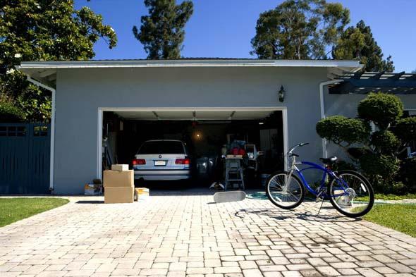 The next time you drive down your street, take note of how many garage doors are open.