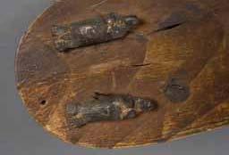 Item number: Fry0165 Item Number: Fry0165 Category: Unknown Materials: Wood Description: This unusual wooden object has two carved sea otters attached to the flat surface at one end.