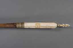 Item number: Fry0187 Item Number: Fry0187 Category: Dart Materials: Wood, walrus ivory and string lashings Description: Relatively short unfletched sealing dart, to be thrown with an atlatl, probably