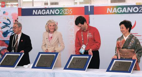 Non-Sports Programs Taking palm imprints in memory of the Nagano Games.