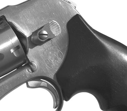 (right). Cocked to single action as shown, this S&W 649 can be a problem waiting to happen in a tactical situation.
