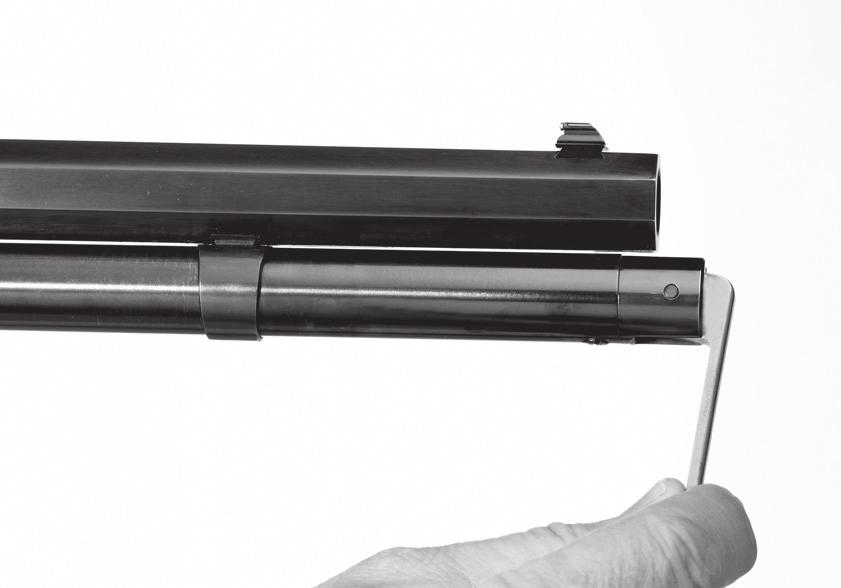 Rotate the takedown lever counterclockwise at least five full turns to disengage the magazine tube and magazine follower from the receiver