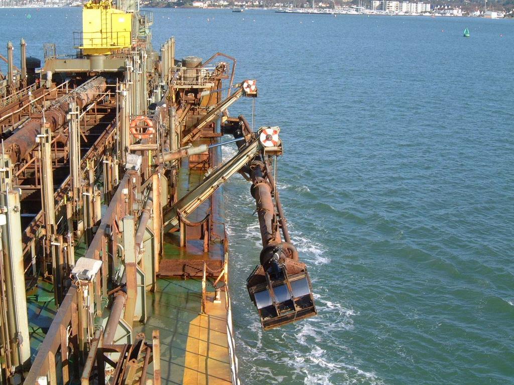 Suction arm on dredger about