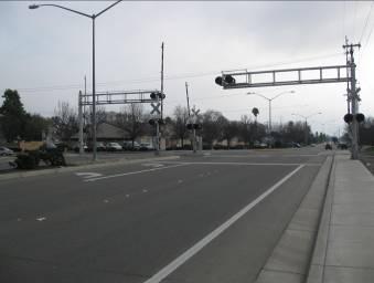 This nearby intersection is stop sign controlled and thus does not require coordinated signals. 6.