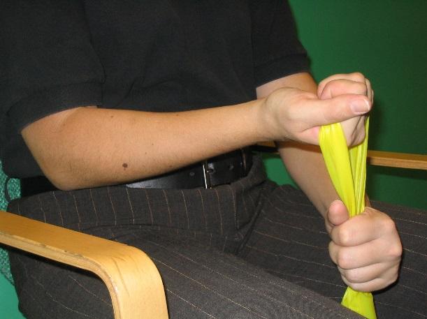 Wrist Curl Hold band in fist with palm up. With opposite hand hold the ends of the band tight.