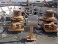 Vertical capstans use a vertical shaft, with the motor and gearbox situated below the winch unit (usually below decks).