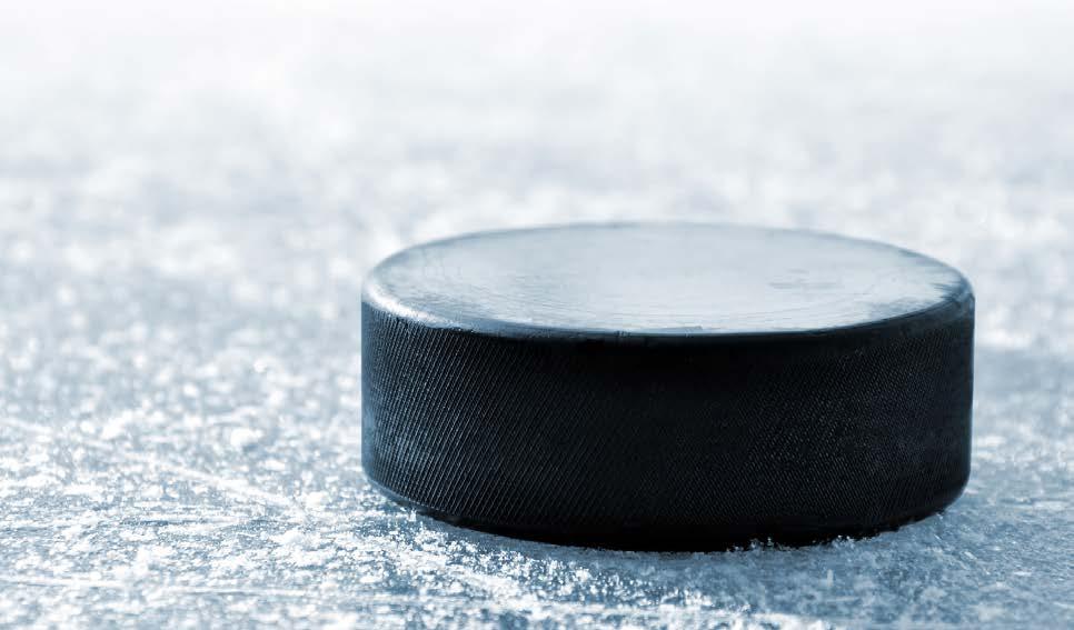 A hockey puck is made of vulcanized rubber, weighing in at six ounces and is three inches in diameter. Pucks are frozen before entering play to make them more bounce resistant.