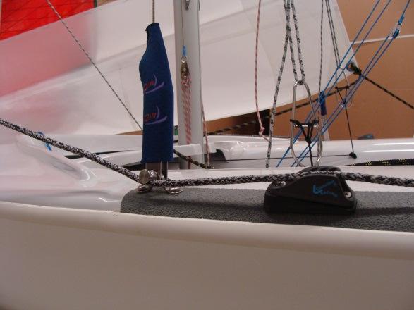 Attach the head first by tying a bowline through the grommet.