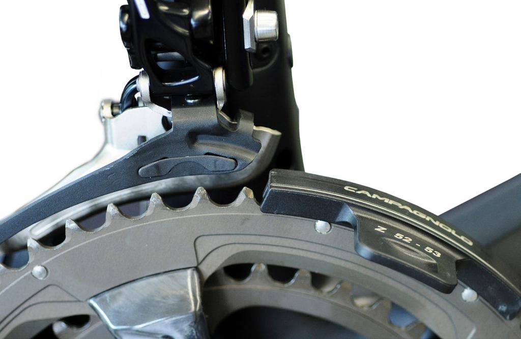 6) Turn the front derailleur until the outer cage plate is perfectly parallel to the white line (Fig.11).