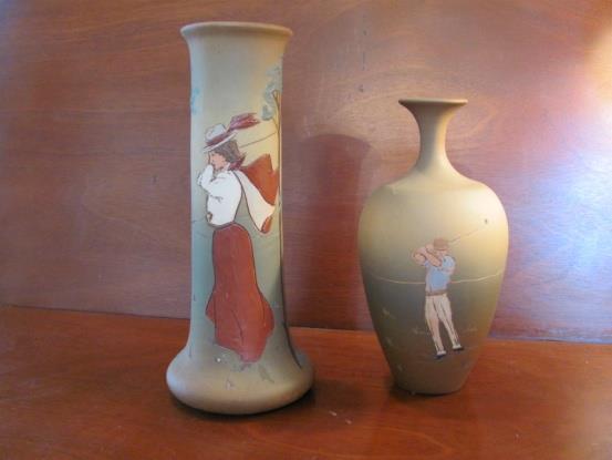 Photo #3715, Lots #16 & 17. 17. Wheller Dickens Ware Long Neck Bud Vase, measuring 8 tall with a image of a male golfer swinging, outstanding.. Sale price @ $800 18.