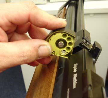 To refit the magazine, fully cock the rifle, grip the magazinein the same fashion and reverse the process sliding the