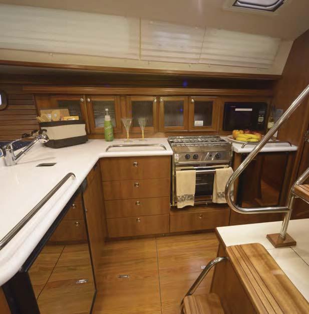 The aft stateroom spans the entire width of the boat providing room for dual hanging lockers, drop-in storage, dressing
