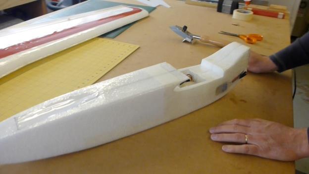Tail Fin Installation 42. Temporarily place the wing in the saddle with the top and bottom fin in position.