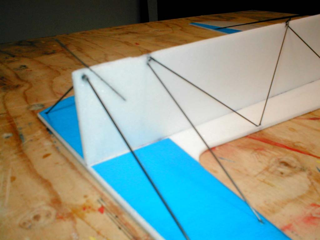 To support the tail of the plane, so the rudder doesn t drag on the ground, I insert a small piece of flat.5mm x 3mm x 7mm carbon rod at about a 30 degree angle near the rudder post.