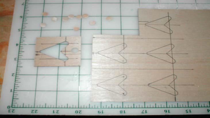 I trace a control horn via a template on a 1/64 thick piece of plywood. I then mark were the holes will go with a sharp point.