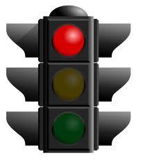 Obeying traffic signs and signals - Stopping for red lights, yellow lights, stop signs etc.