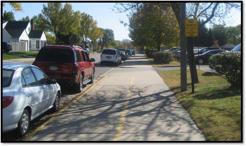 Avenue is the most walkable and bikeable neighborhood based on the existing sidewalks and lack or major roadway crossings. Parent vehicles parked in the bus loading zone on 9 th Avenue. South St.