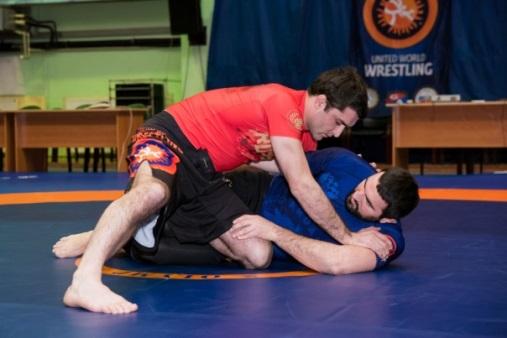 Back Mount Restart Position Back Mount Restart occurs at the center of the mat with both athletes sitting on the ground, with the athlete that secured