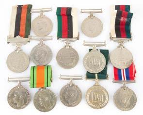 411 Twelve assorted British medals some ascribed Est $300-500 412 Seven assorted medals including: Greek Cross, First Balkan war cross, WWII air Corp mechanic medal, Austrian medal for bravery