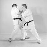 Finally, he strikes an ipponken with his left hand to the centreline of the attacker and