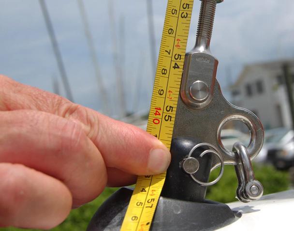 Adjust the upper shroud lengths until the mast is centered and the halyard to shear lengths are the same from side-to-side.