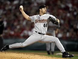 Raise throwing arm up into throw while in SET position as close to center as possible. Put L position. Glove out front.