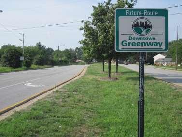 Creating expectations for future funding and greenway facilities can help create momentum for funding and document a need for the community, such as this signage for a planned greenway in downtown