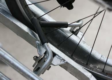 As as you push the bike up the channel the front wheel is released and then back wheel is clamped securely into place.