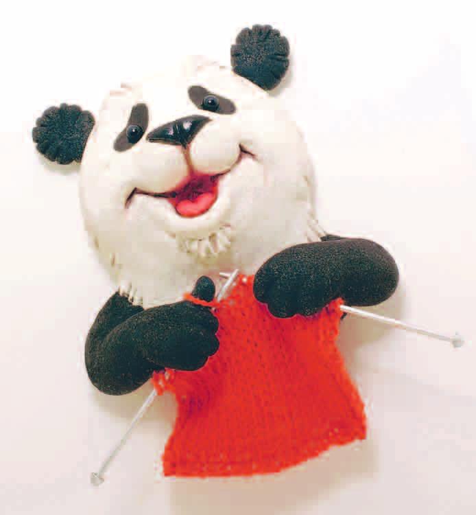 He thought and thought. I ll make a place mat for my table, he said. Again, Panda began to knit. Clack, clack went the needles. Panda sang a little song as he worked. Highlights for Children, Inc.