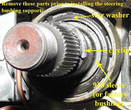 PHOTO 3 e. Remove the large external star washer. You can pry up the tangs and it will pop out. Keep this for your parts bin, but you won t need it with the new bushing. f. Scribe hub to steering shaft.