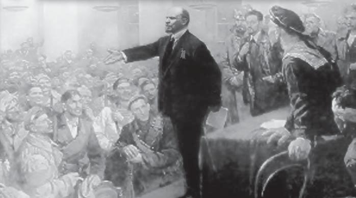 Si Lenin noong Oktubre 1917, sa harap ng mga representante ng matagumpay na rebolusyonaryong mga manggagawa, magsasaka at sundalo sa Winter Palace.