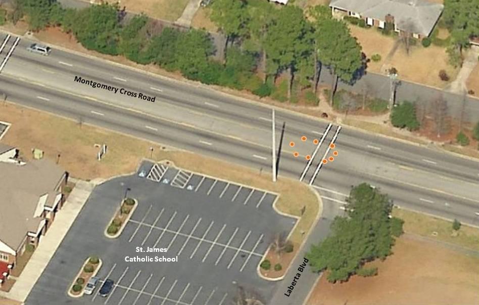 7. Deploy cones or temporary barriers: In the center turn lane, orange cones or temporary concrete barriers could be used to surround the crosswalk during the hours that the school speed zone is in