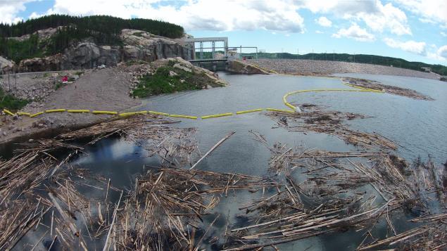 10. The boom operation The boom was completed in April 2014, two months before the flooding reached the booms. A large amount of debris floated towards the booms, the spillway and the water intake.