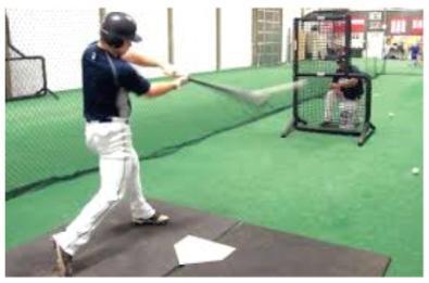 The process of tossing the ball should be one continuous movement that includes these three stages: 1) show the ball to the batter, 2) swing the arm down and back up towards the release point, and 3)
